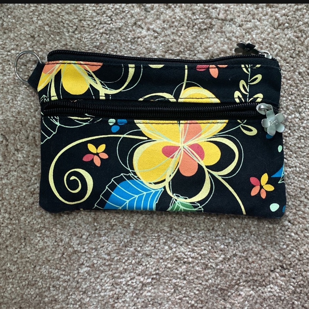 Small Hawaiian bag with plumeria hardware.